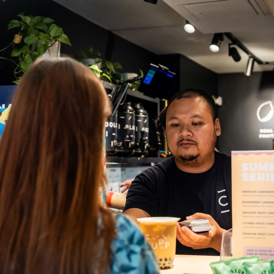 Staff serving customer over the counter at CUPP