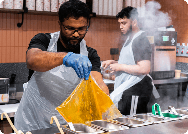 Kitchen workers prepping food