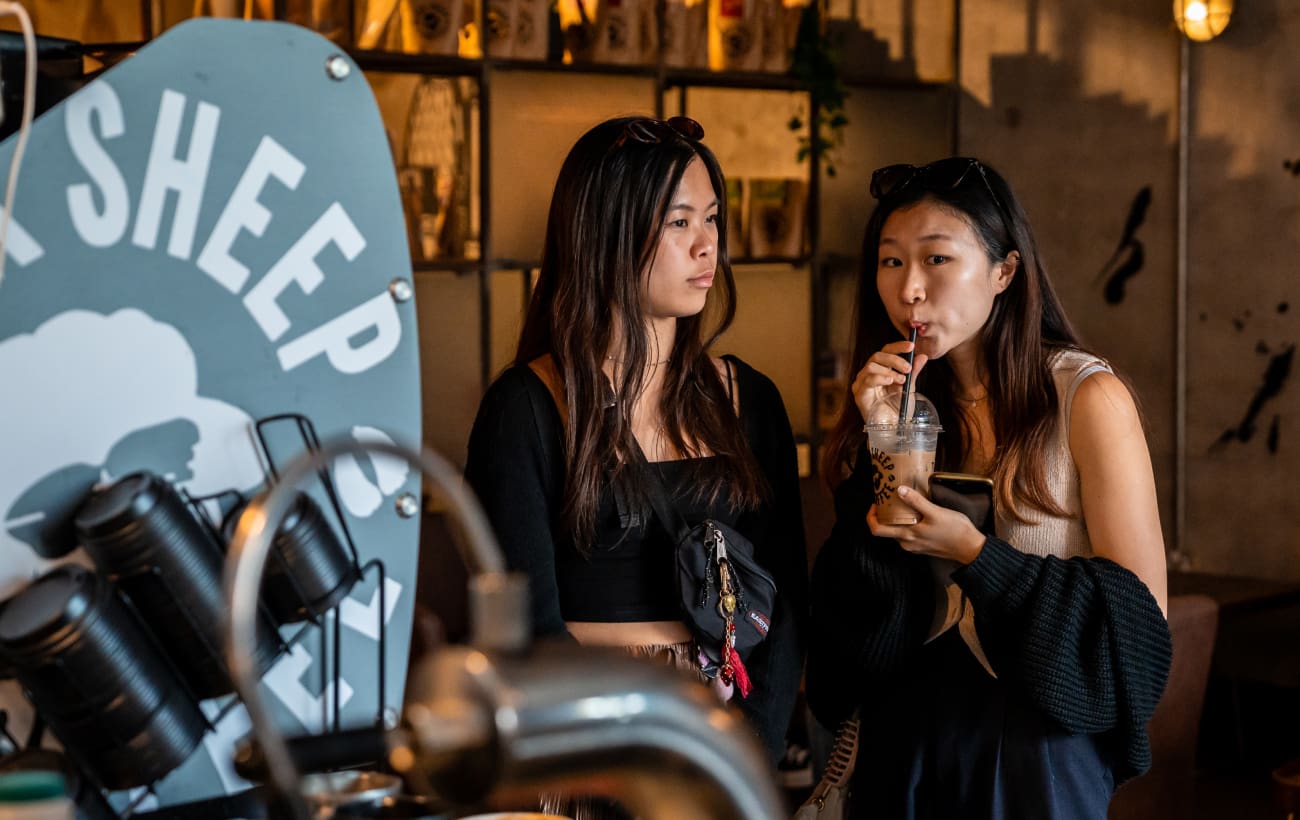 customers in a coffee shop drinking iced coffee