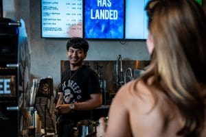 Black Sheep Coffee worker behind the counter