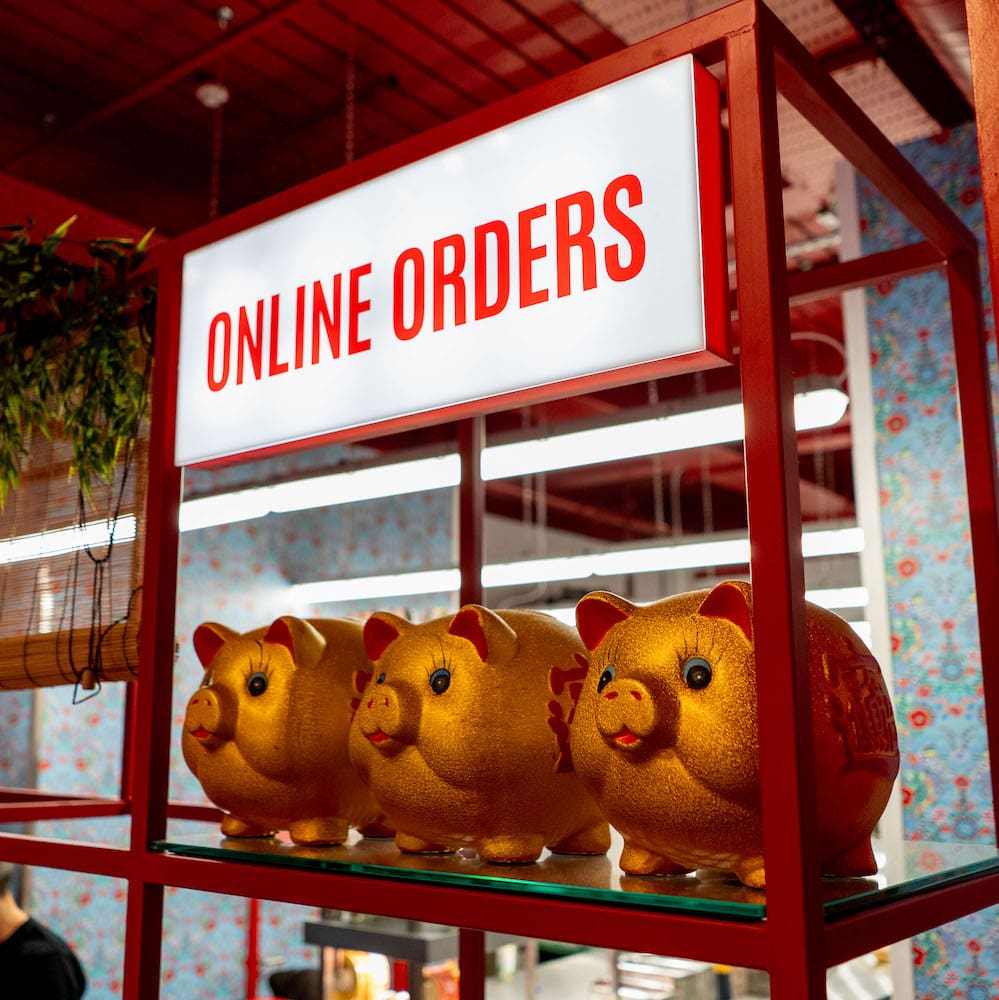 Hop vietnamese order collection area with three gold pigs