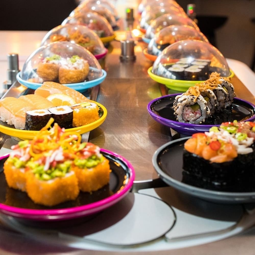 lots of dishes served up on Yo sushi's conveyor belt restaurant